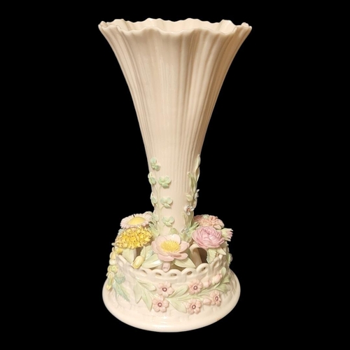 190 - BELLEEK, A 20TH CENTURY IRISH PORCELAIN TRUMPET VASE
The central reeded trumpet with applied floral ... 