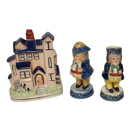 203 - A LATE VICTORIAN STAFFORDSHIRE NOVELTY POTTERY MONEY BOX MODELLED AS A HOUSE
Two Victorian Staffords... 