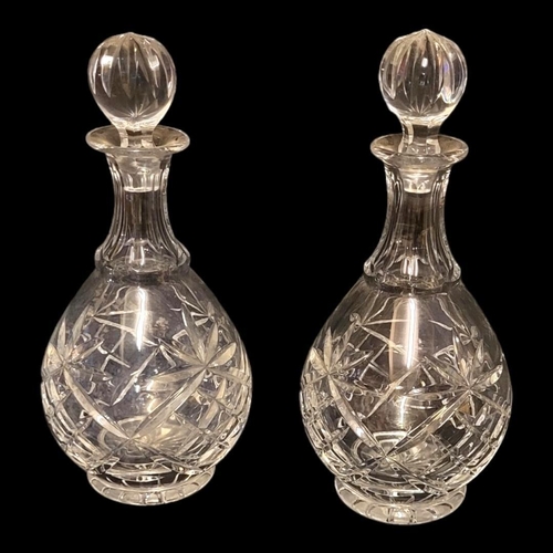 214 - A PAIR OF EARLY 20TH CENTURY GLASS LEAD CRYSTAL DECANTERS AND STOPPERS 
Prussian globular body cut w... 