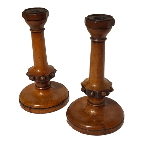 219 - A PAIR OF 19TH CENTURY BOXWOOD CANDLESTICKS
Having octagonal sconce and carved decoration to central... 