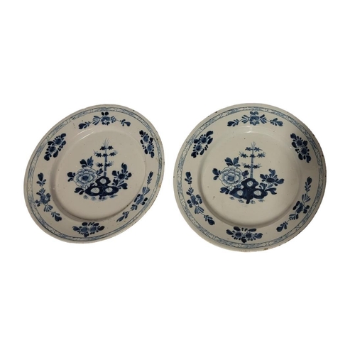 223 - A PAIR OF 18TH CENTURY DUTCH DELFT POTTERY CHARGER DISHES
Central cartouche of bamboo shoots and fau... 