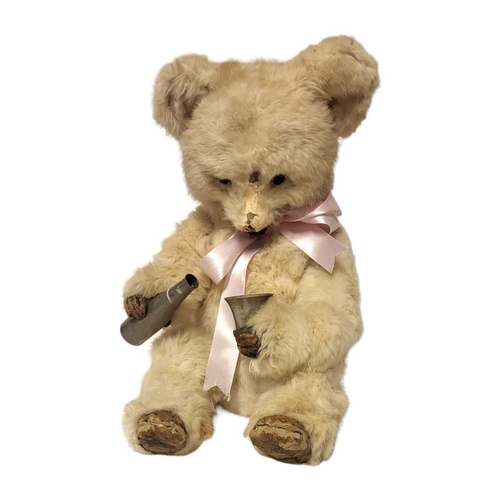 232 - A LATE 19TH/EARLY 20TH CENTURY 'DRINKING BEAR' AUTOMATON
Having white animal fur with skin hide hand... 