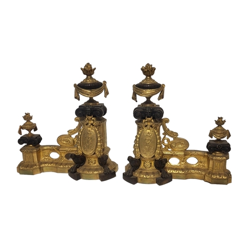 234 - A PAIR OF FRENCH 19TH CENTURY GILT BRONZE CHENETS 
Classical form with urn finials and figural carto... 