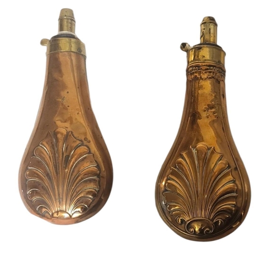 240 - TWO 19TH CENTURY COPPER AND BRASS POWDER FLASKS
Having embossed shell form decoration.
(approx 20cm)... 