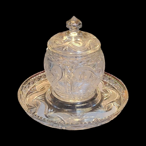 244 - A LARGE EARLY 20TH CENTURY CUT LEAD CRYSTAL PUNCH BARREL AND TRAY
Having deep cut swirled decoration... 