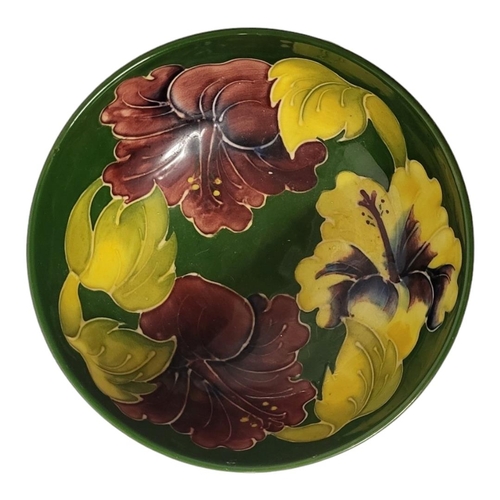 249 - A MID 20TH CENTURY WALTER MOORCROFT POTTERY PEDESTAL BOWL IN HIBISCUS PATTERN
Interior and exterior ... 