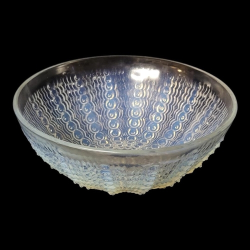 257 - LALIQUE, AN OPALESCENT CLEAR AND FROSTED ART GLASS BOWL 
Moulded design of raised spiral beads, stai... 