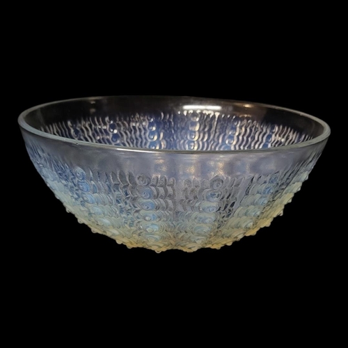 257 - LALIQUE, AN OPALESCENT CLEAR AND FROSTED ART GLASS BOWL 
Moulded design of raised spiral beads, stai... 