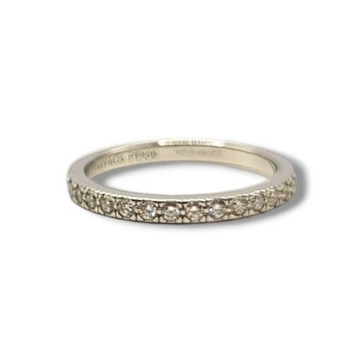 26 - TIFFANY & CO., A PLATINUM AND DIAMOND FULL ETERNITY RING
Having a row of round cut diamonds.
(size I... 