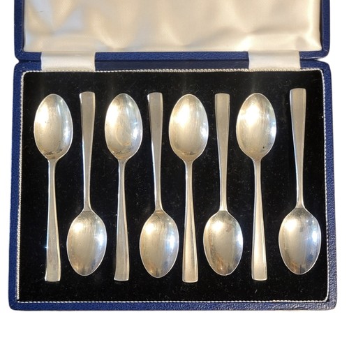 39A - A SET OF EIGHT MID CENTURY  SILVER TEASPOONS
Plain form, in a fitted velvet lined box, hallmarked Sh... 