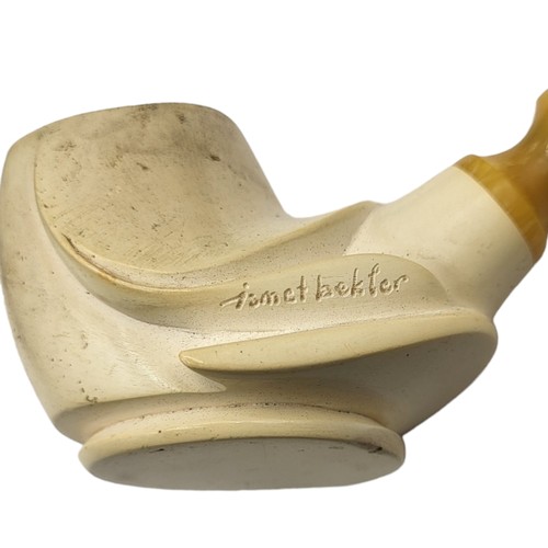 233B - ISMET BEKLER, A 20TH CENTURY MEERSCHAUM PIPE
Having a carved bowl and amber handle, together with a ... 