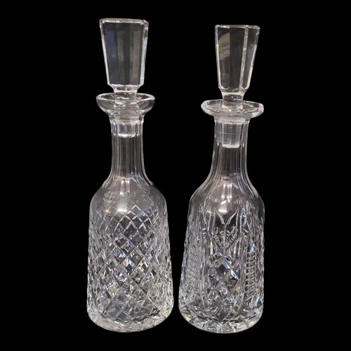 430 - TWO LEAD CRYSTAL CUT GLASS DECANTERS AND STOPPERS (POSSIBLY WATERFORD AS WELL)
The bodies panel cut ... 