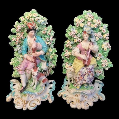 435 - A PAIR OF 18TH CENTURY DERBY FIGURAL GROUPS, FEMALE MUSICIAN PLAYING A LUTE 
With sheep standing bes... 