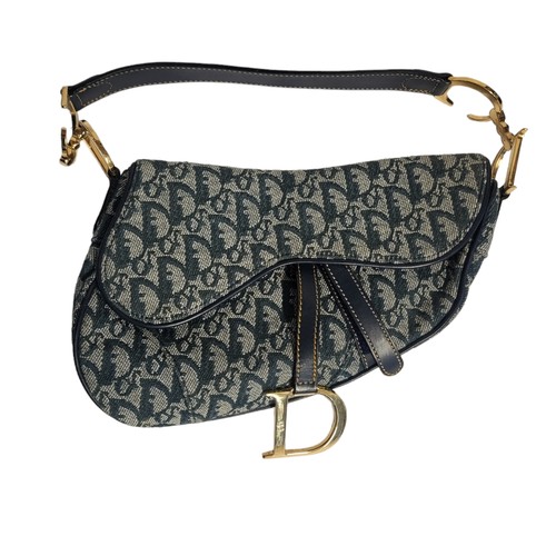 468 - CHRITIAN DIOR, A VINTAGE LEATHER AND CANVAS SADDLE BAG
Blue leather strap with gilt attachments and ... 