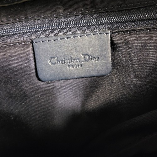 468 - CHRITIAN DIOR, A VINTAGE LEATHER AND CANVAS SADDLE BAG
Blue leather strap with gilt attachments and ... 