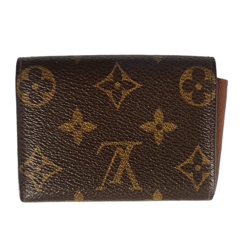 469 - LOUIS VUITTON, A BROWN LEATHER  ELISE MONOGRAM SMALL WALLET
With gilt brass button and two internal ... 