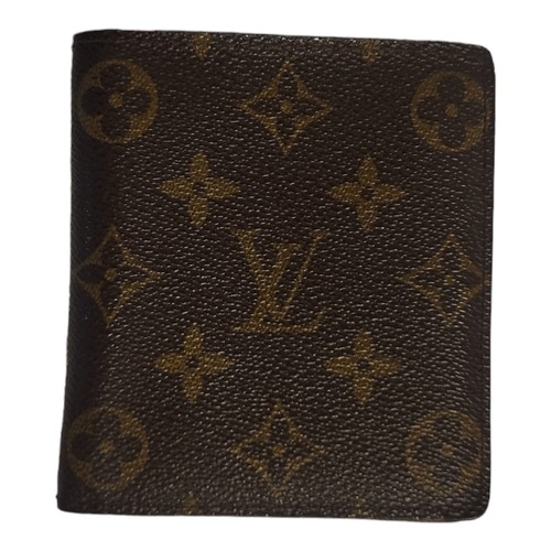 470 - LOUIS VUITTON, A BROWN LEATHER MONOGRAM WALLET
Card spaces and large note compartment, marked to int... 