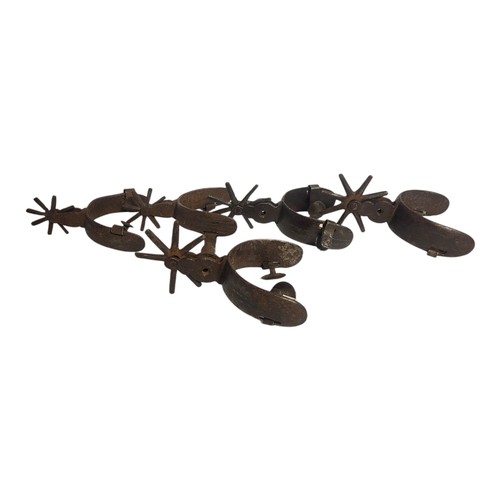 479 - A COLLECTION OF 19TH CENTURY AMERICAN CAST IRON COWBOY SPURS
Two pairs and one single spur.
(largest... 