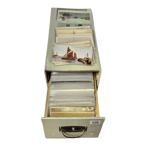 539 - A TABLETOP FILING CABINET 
Containing approximately 400 early 20th Century later postcards, ships, N... 