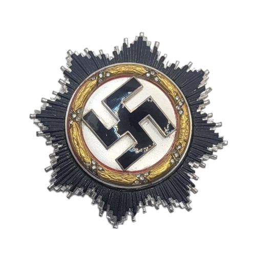 551 - A GERMAN WWII WAR ORDER OF THE GERMAN CROSS MEDAL (POSSIBLY VERY GOOD COPY)
Gold bezel with diamonds... 