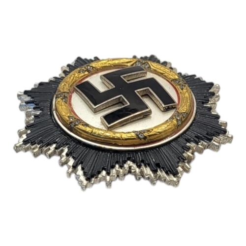 551 - A GERMAN WWII WAR ORDER OF THE GERMAN CROSS MEDAL (POSSIBLY VERY GOOD COPY)
Gold bezel with diamonds... 