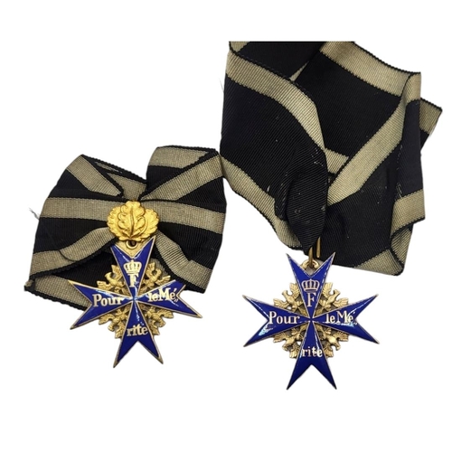 554 - TWO IMPERIAL GERMAN POUR LE MERITE MEDALS (POSSIBLY VERY GOOD COPIES)
Gilt ground with blue enamel, ... 