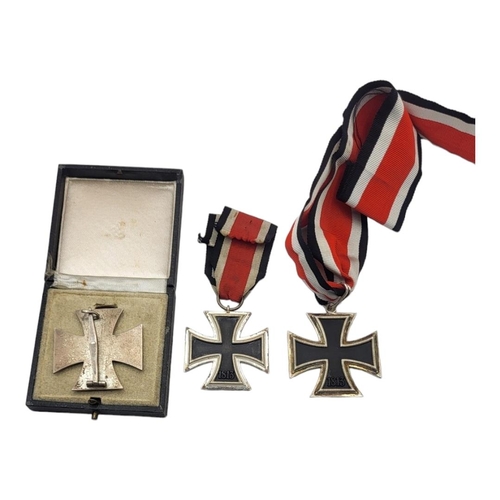 559 - A WWII GERMAN IRON CROSS MEDAL
Its class with pin back, marked ‘26’ for BH Mayer, in a fitted box, t... 