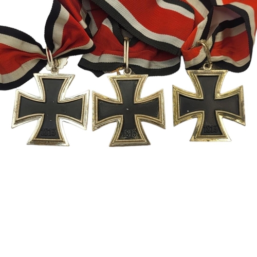 560 - A COLLECTION OF THREE WWII GERMAN IRON CROSS WITH OAK LEAF MEDALS, DATED 1813 - 1939 (GOOD COPIES)
W... 