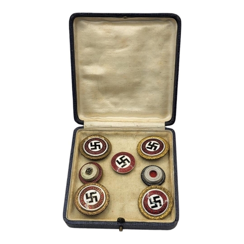 562 - A COLLECTION OF FOUR WWII GERMAN NATIONAL SOCIALIST ENAMEL BADGES
Red white and black enamel marked ... 