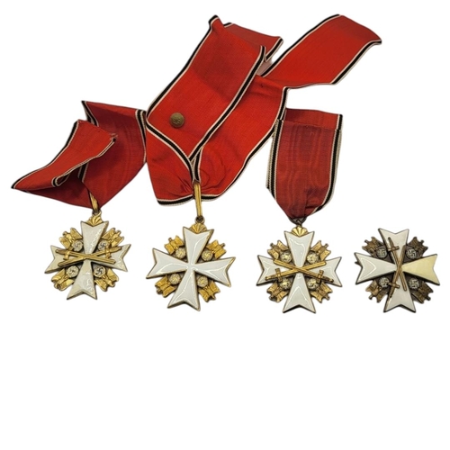 567 - A COLLECTION OF THREE WWII GERMAN EAGLE STAR MEDALS
White metal with enamel on red, black and white ... 