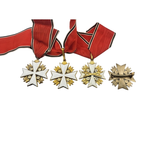 567 - A COLLECTION OF THREE WWII GERMAN EAGLE STAR MEDALS
White metal with enamel on red, black and white ... 