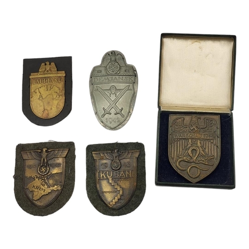 570 - A COLLECTION OF WWII GERMAN CAMPAIGN ARM SHIELDS (LATER COPIES)
Comprising Warschau 1944, Kuban 1943... 