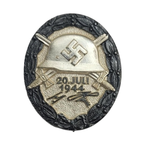 581 - A WWII GERMAN 'HITLAR BOMB PLOT' WOUND BADGE (VERY GOOD COPY)
Having black enamel to wreath, dated 2... 