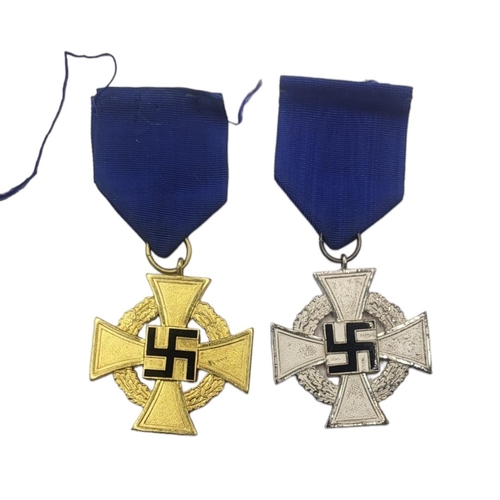 584 - TWO WWII GERMAN NSDAP FAITHFUL SERVICE MEDALS
Silver 25 years and gold 40 years with blue fabric rib... 