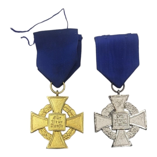 584 - TWO WWII GERMAN NSDAP FAITHFUL SERVICE MEDALS
Silver 25 years and gold 40 years with blue fabric rib... 