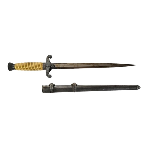 594 - A GERMAN WWII HEER OFFICERS DAGGER AND SCABBARD BY W.K.C., SOLIGEN.
(blade 26.5cm, overall 37.5cm)

... 