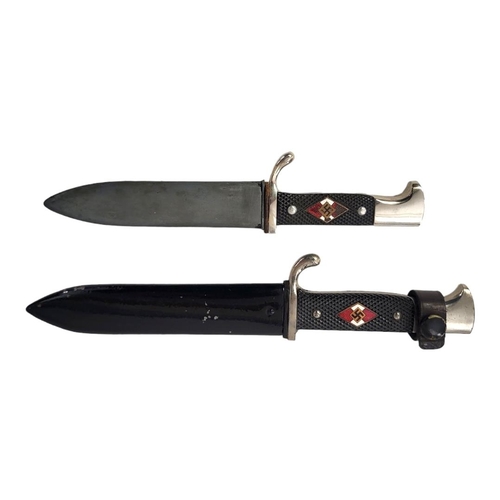 597 - A GERMAN WWII HITLER YOUTH DAGGER AND SCABBARD 
By Eickhorn along with a shorter version.

Condition... 