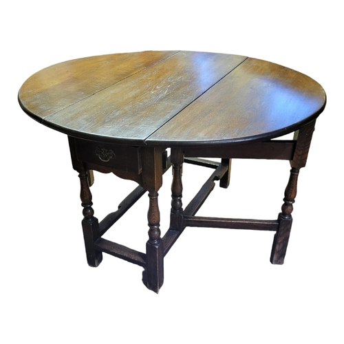 913 - A 17TH CENTURY DESIGN OAK GATELEG TABLE
with single drawer, raised on square and turned legs, circa ... 