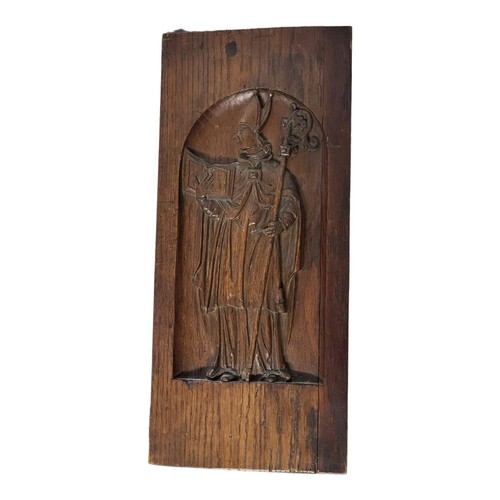 335 - A 19TH CENTURY ECCLESIASTICAL CONTINENTAL OAK PANEL OF ARCHBISHOP IN CHURCH REGALIA 
Centrally carve... 