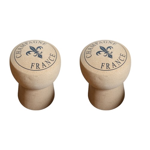 267 - A PAIR OF CHAMPAGNE CORK STOOLS
Having ‘Champagne France’ and fleur-de-lis insignia on the seat. 
(3... 