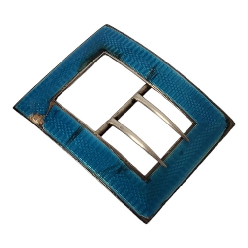 4A - AN EDWARDIAN LIBERTY & CO. SILVER BELT BUCKLE
Birmingham, 1908, with a blue turquoise enamel engine ... 