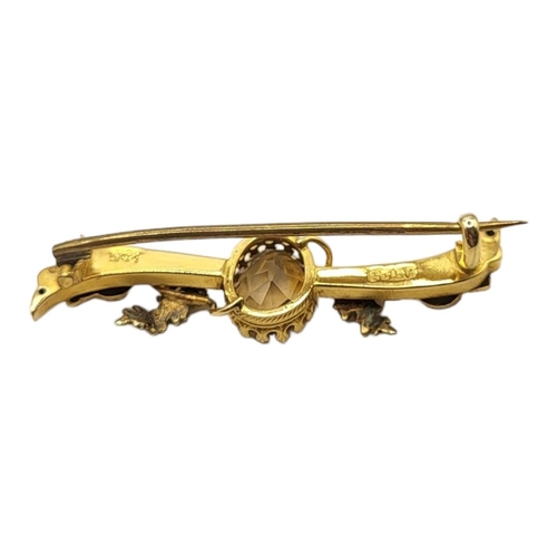 156 - HINDS OF ISLINGTON, A VICTORIAN 9CT GOLD AND CITRINE BROOCH
The oval cut stone with Scottish thistle... 