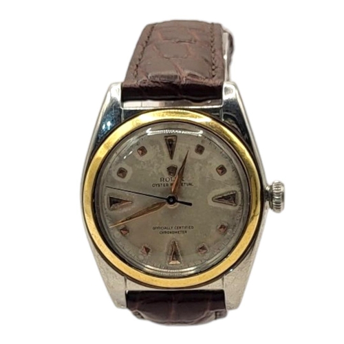 16 - ROLEX, OYSTER, A VINTAGE STAINLESS STEEL BUBBLEBACK GENT’S WRISTWATCH
Having a gold bezel, silver to... 