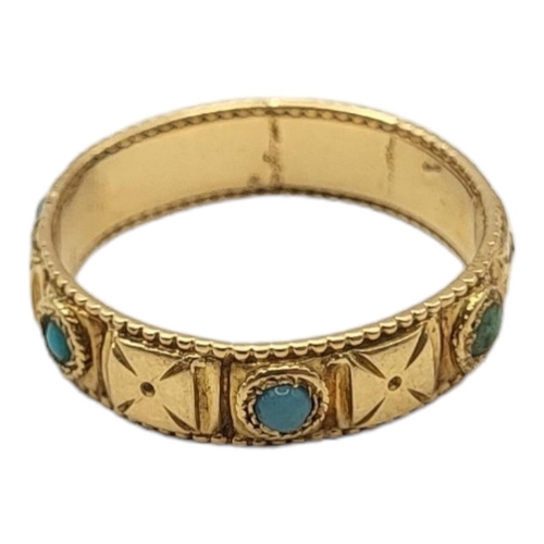 17A - AN EARLY 20TH CENTURY YELLOW METAL AND TURQUOISE WEDDING BAND
having a Maltese cross speeding and ca... 