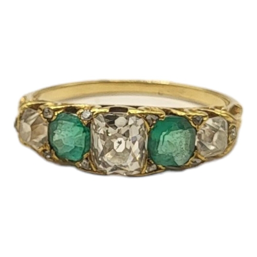 180 - A LATE 19TH/EARLY 20TH CENTURY YELLOW METAL, DIAMOND AND EMERALD FIVE STONE RING
Graduated old cut d... 