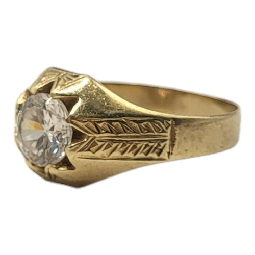 181 - A VINTAGE 9CT GOLD AND QUARTZ GENTS SIGNET RING
The single round cut stone with engraved decoration ... 