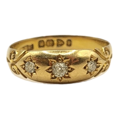 182 - AN EARLY 20TH CENTURY 18CT GOLD AND DIAMOND THREE STONE RING
Rubover setting with three graduated ro... 