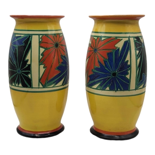 201 - CLARICE CLIFF, FANTASQUE RANGE, A PAIR OF ART DECO BALUSTER VASES
Umbrella pattern, Circa 1929, shap... 