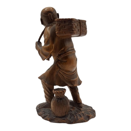 212 - A FINE JAPANESE MEIJI PERIOD, 1868 - 1911, WOODEN CARVING, FARM LABOURER
Wearing a Japanese provinci... 