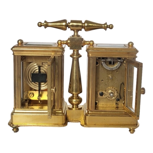 225 - A 19TH CENTURY STYLE GILT BRONZE DOUBLE CARRIAGE CLOCK
Two adjacent bevelled glass panels reveal clo... 